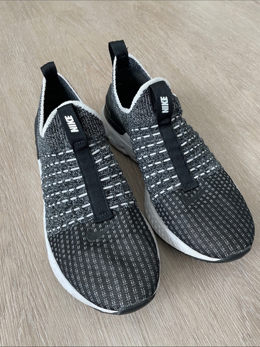 Nike Women’s Black and White Knit Slip-On Sneakers